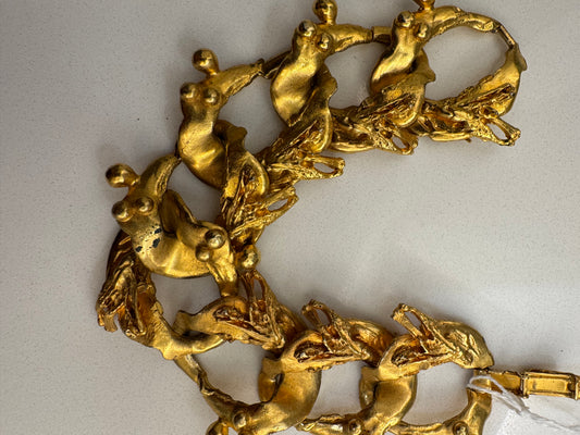 Vintage goldtone signed Hattie Carnegie "NUDES" bracelet