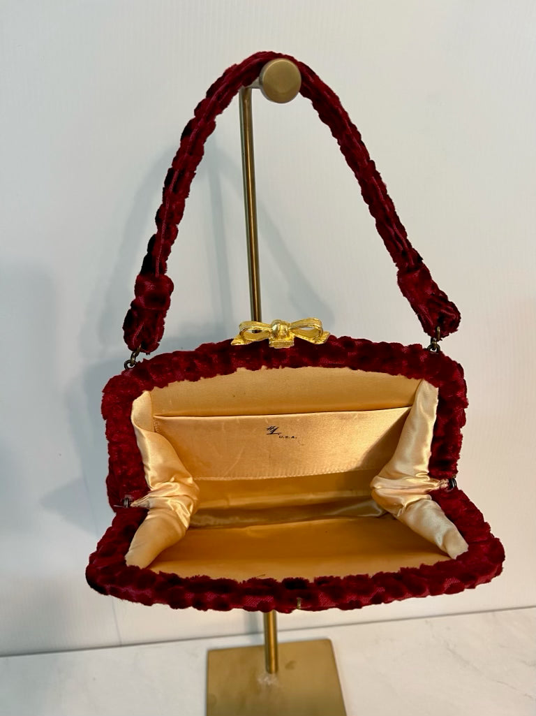 Vintage red velvet top handle bag with gold tone bow closure