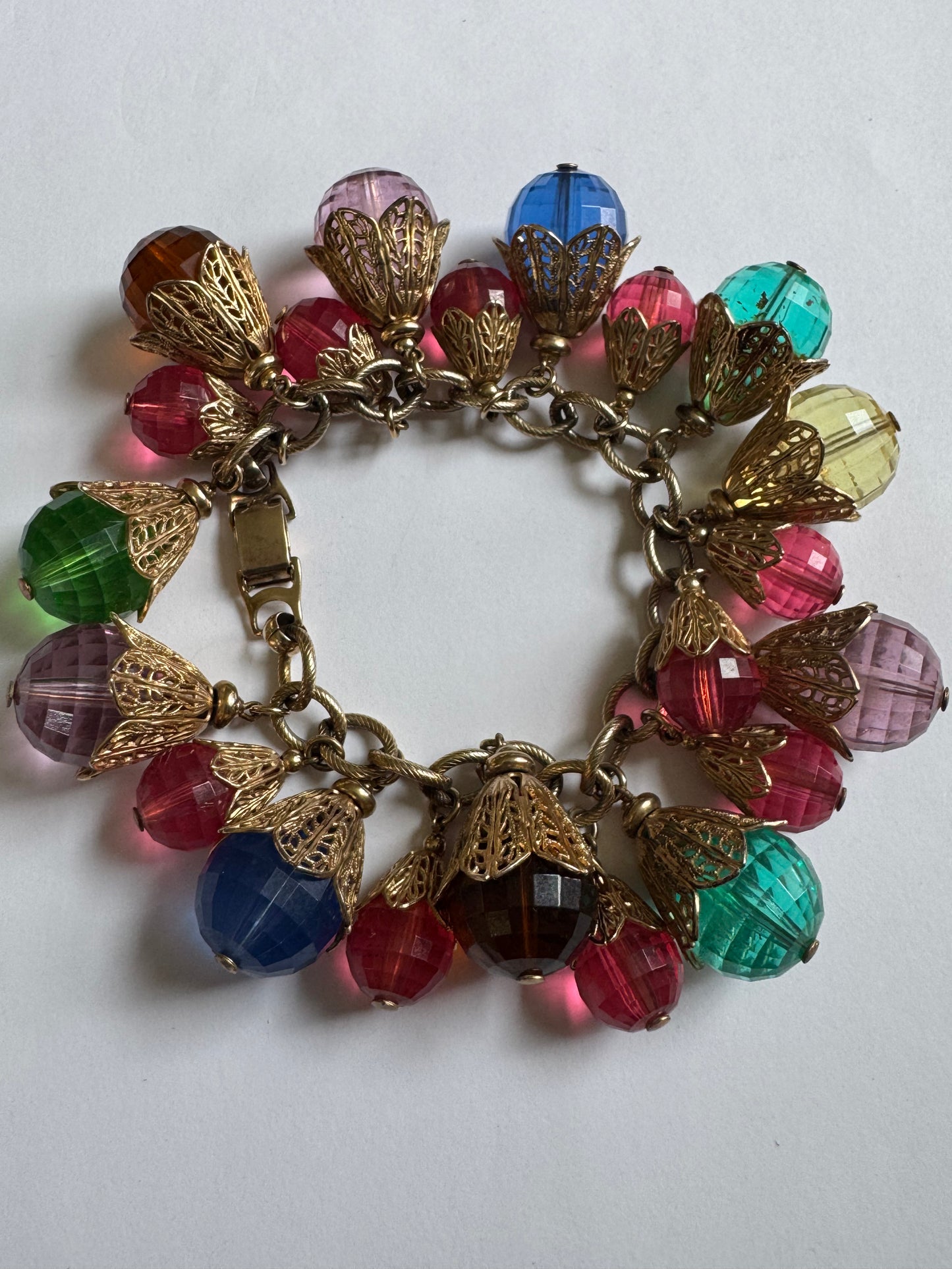 Vintage 1950s brass with gold plate and resin bead charms. A  book piece featured in The Napier Co book page 300.