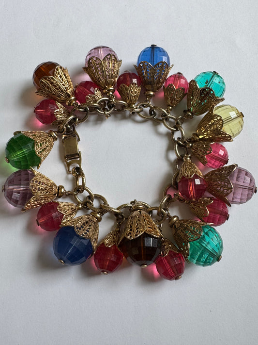 Vintage 1950s brass with gold plate and resin bead charms. A  book piece featured in The Napier Co book page 300.