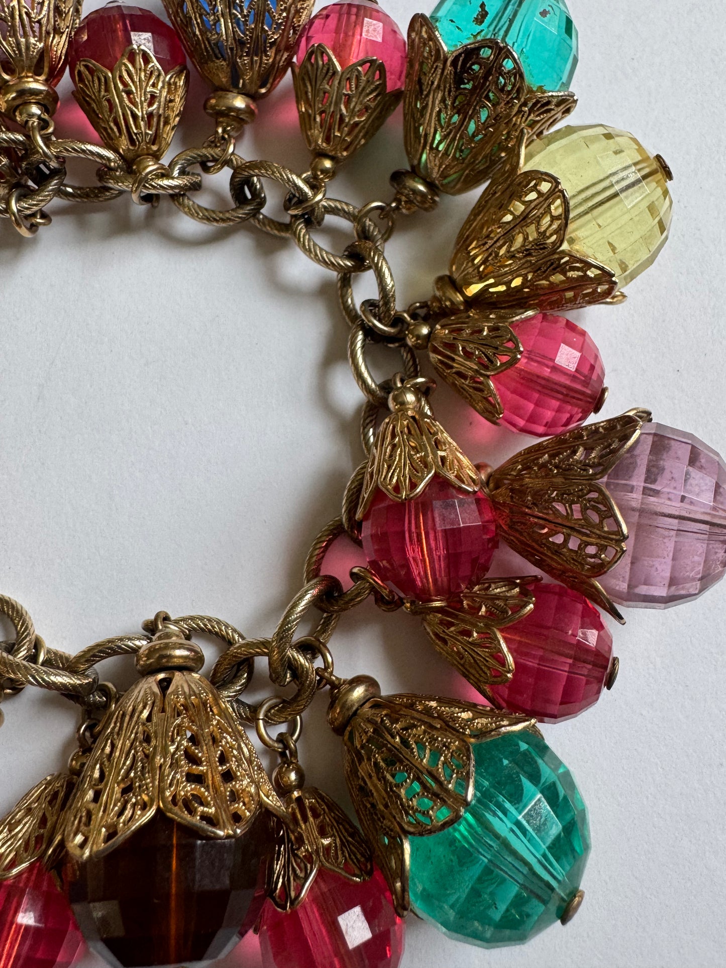 Vintage 1950s brass with gold plate and resin bead charms. A  book piece featured in The Napier Co book page 300.