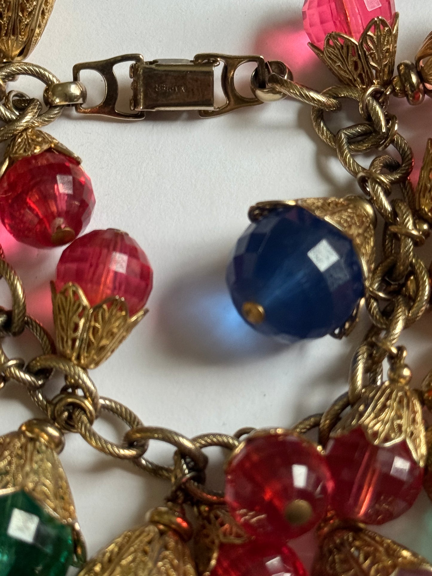 Vintage 1950s brass with gold plate and resin bead charms. A  book piece featured in The Napier Co book page 300.