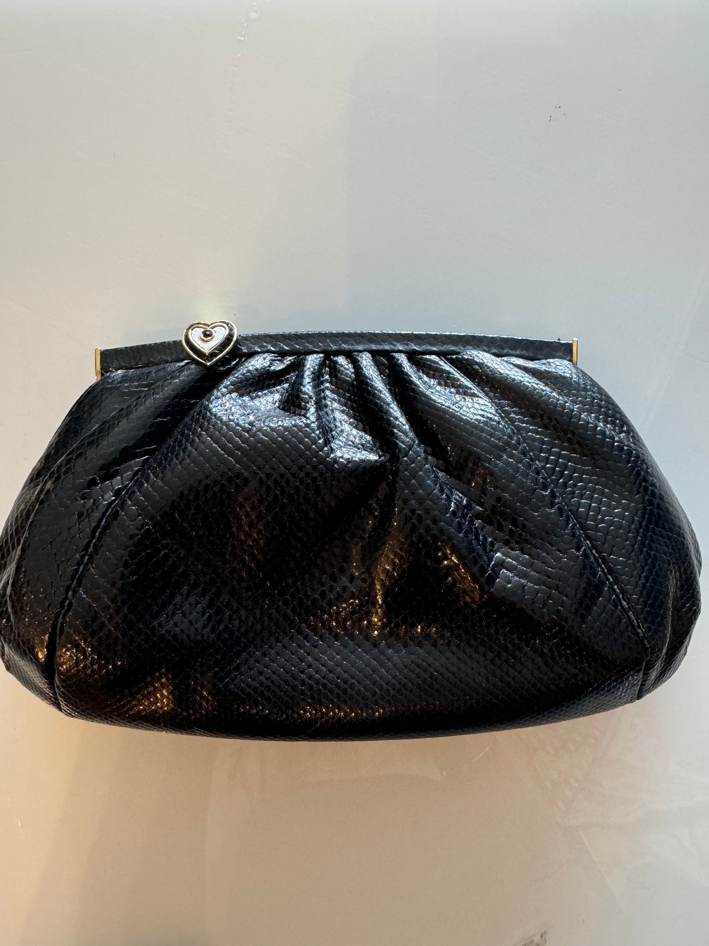 Fabulous Black Judith Leiber skin clutch with gold chain and heart hardware