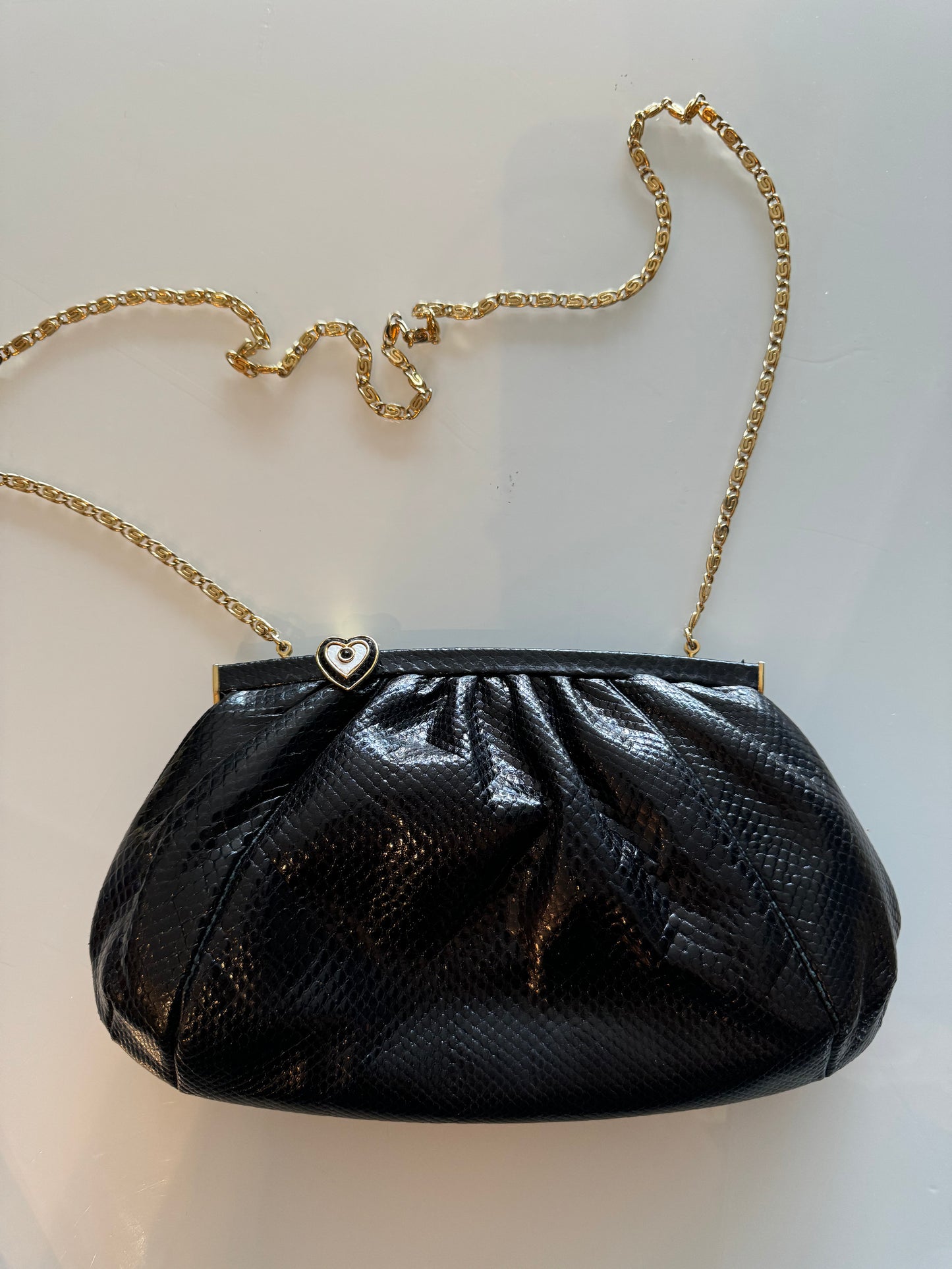 Fabulous Black Judith Leiber skin clutch with gold chain and heart hardware