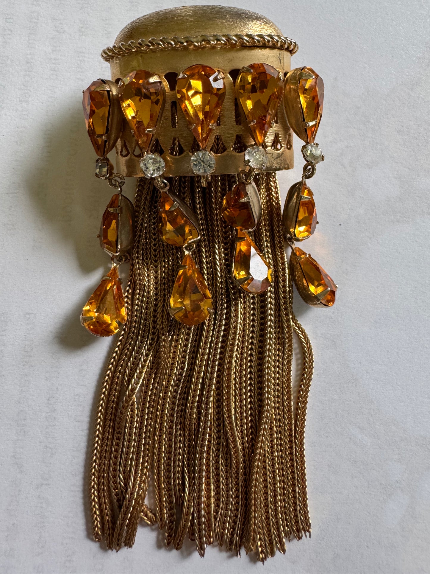 Joseff of Hollywood gold brooch with domed top and cascades of 13 prong set large citrine glass teardrops and 5 round white glass rhinestones w/ tassels.Unsigned Joseff of Hollywood was created for a specific actress for a specific film.