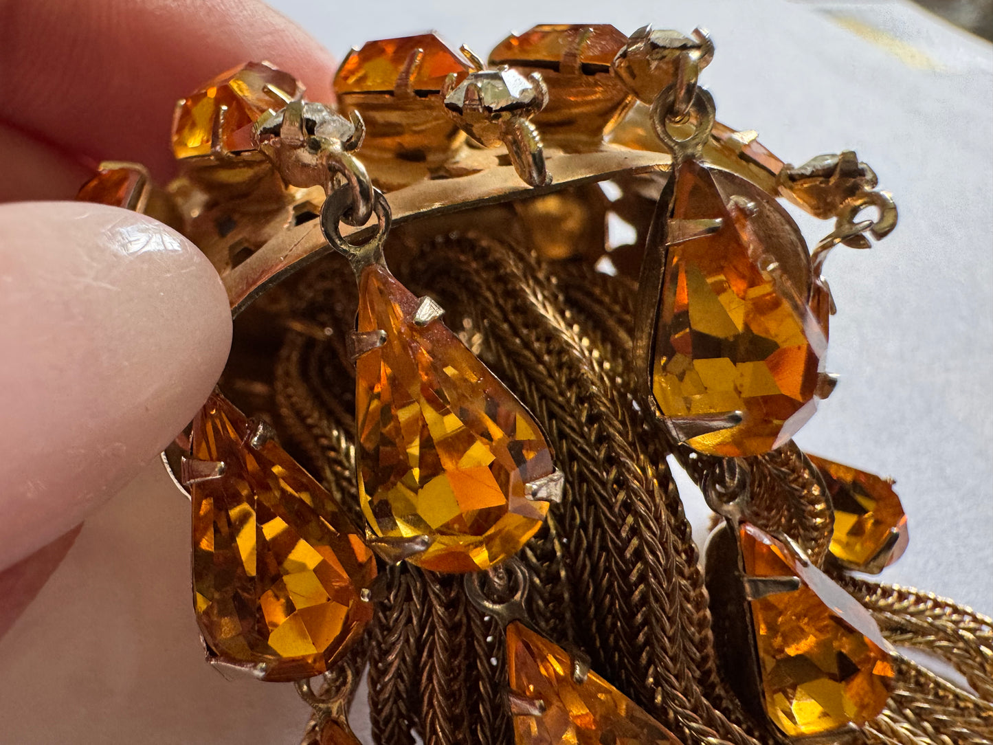 Joseff of Hollywood gold brooch with domed top and cascades of 13 prong set large citrine glass teardrops and 5 round white glass rhinestones w/ tassels.Unsigned Joseff of Hollywood was created for a specific actress for a specific film.