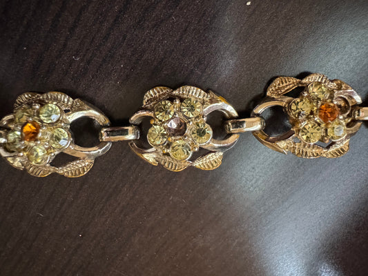 signed CORO Amber colored rhinestone, gold tone bracelet
