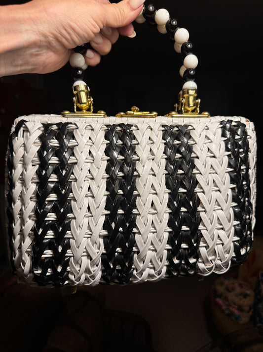Beautiful 1950s black and white wicker top handle bag with beaded handle and fabric interior