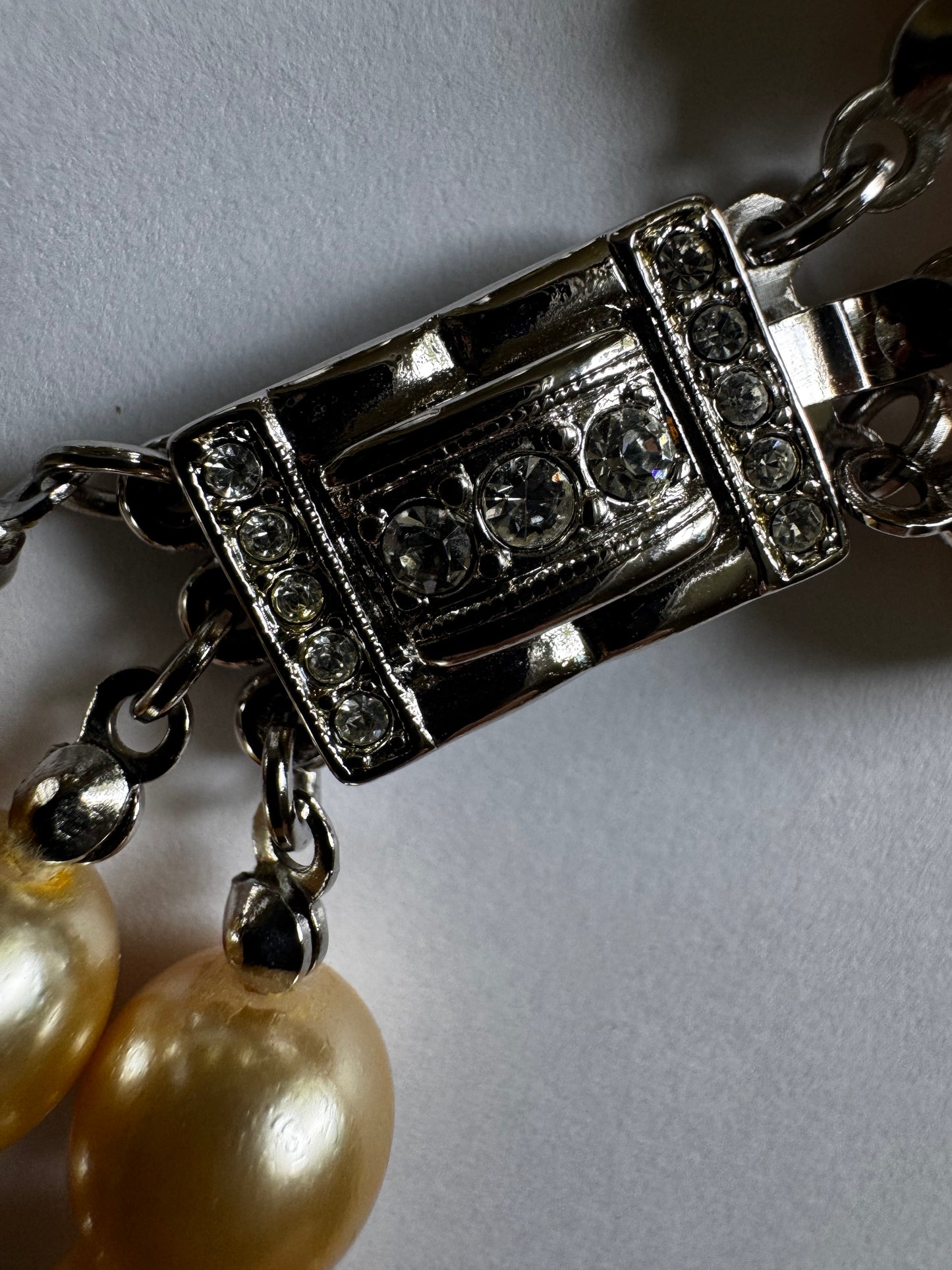 stunning 1960s Kenneth J Ln. triple strand neck, necklace of ivory faux pearls with gorgeous Silvertone rhinestone clasp