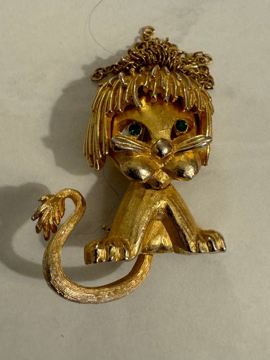 Vintage mini lion brooch with green eyes and tassel head