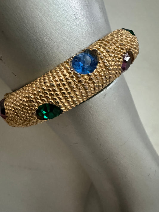 1980s gold tone clamper bracelet with colored stones