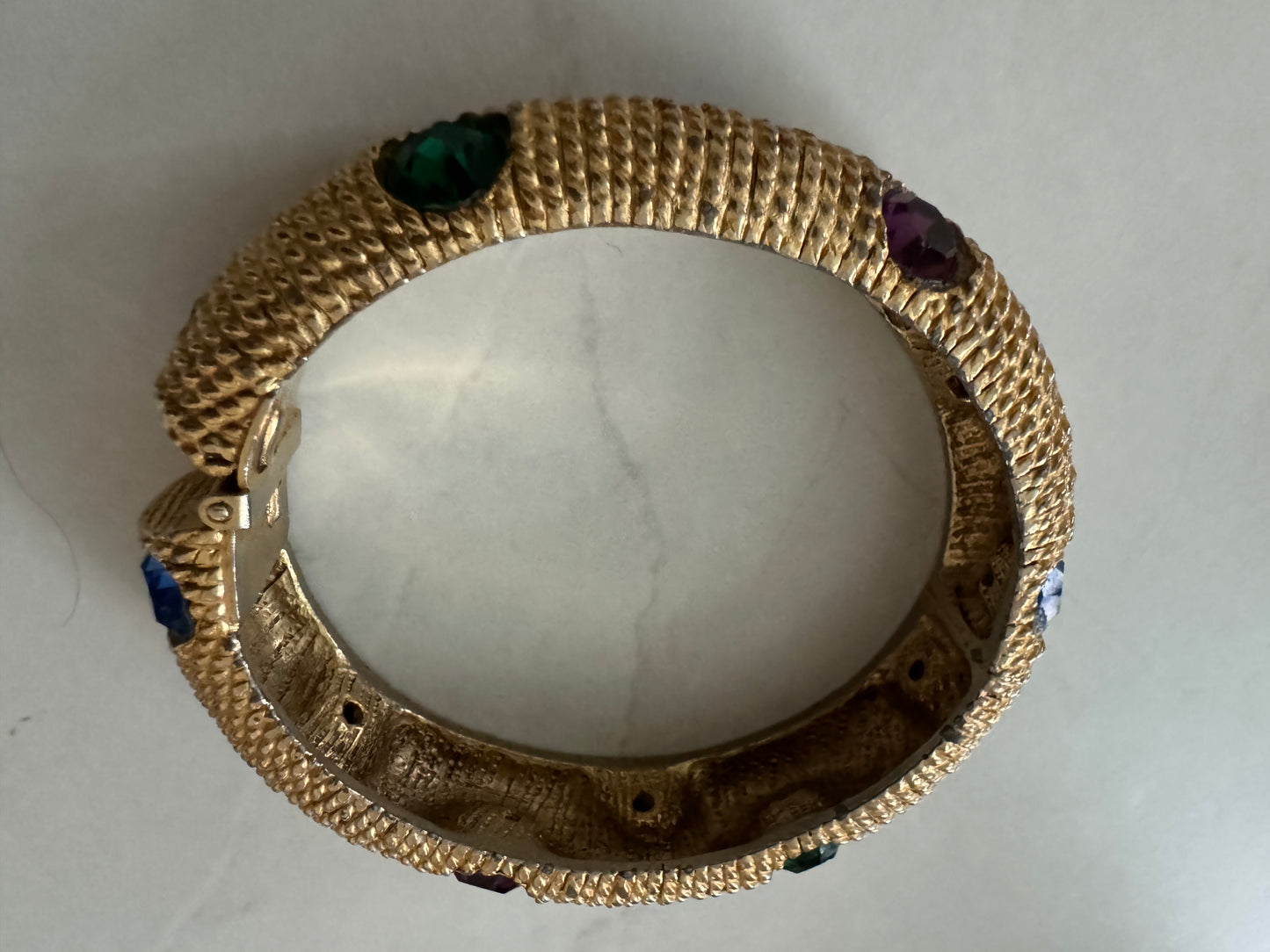 1980s gold tone clamper bracelet with colored stones