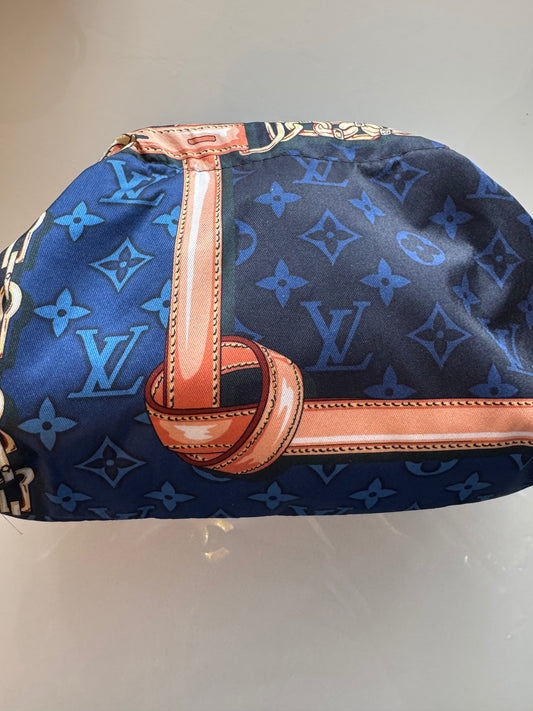 Small designer silk scarf bag reimagined as a cosmetic bag or a clutch.