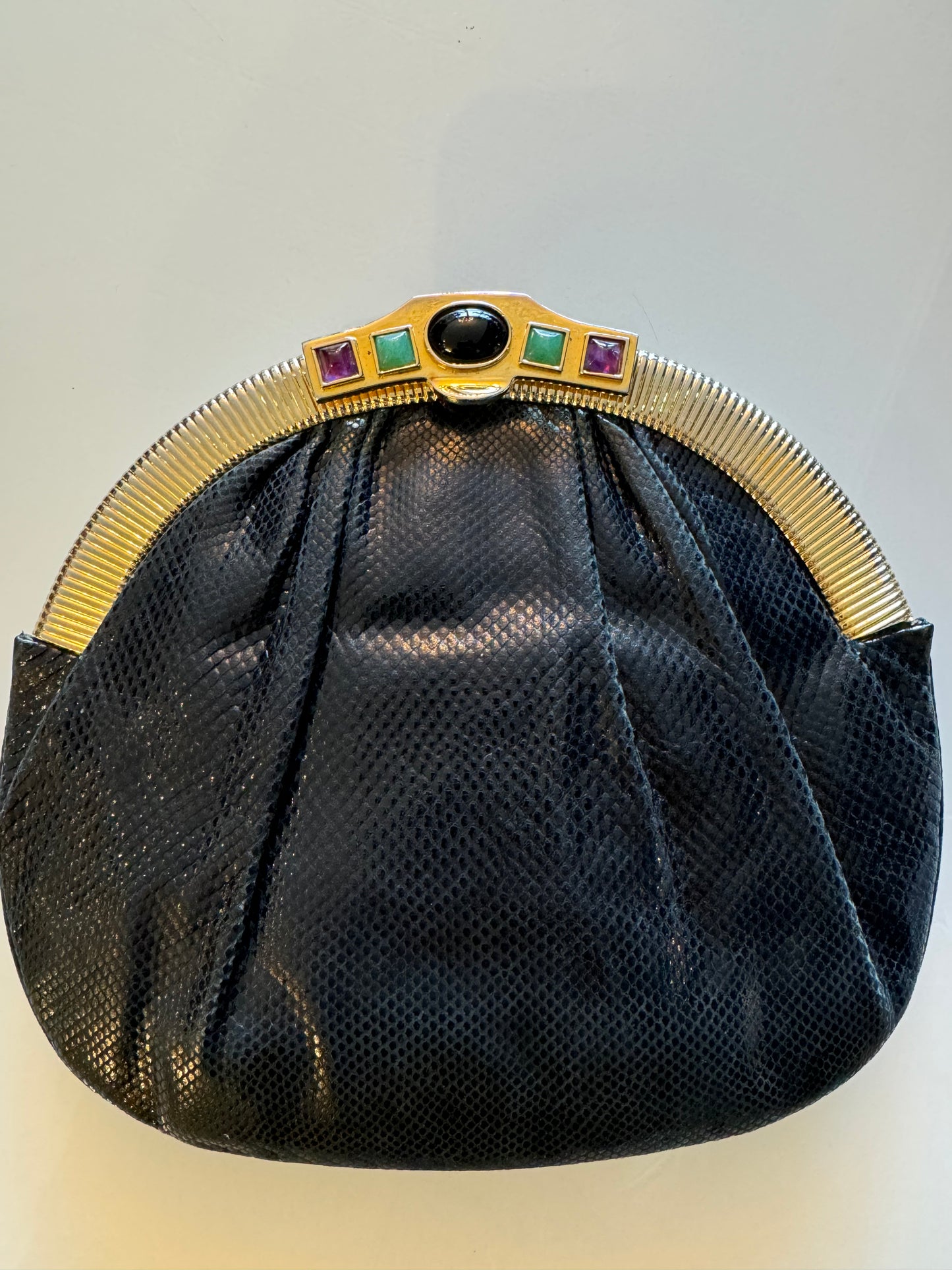 Vintage snakeskin Judith Leiber crystal embellished clutch with convertible shoulder strap, satin lining and gold tone original mirror