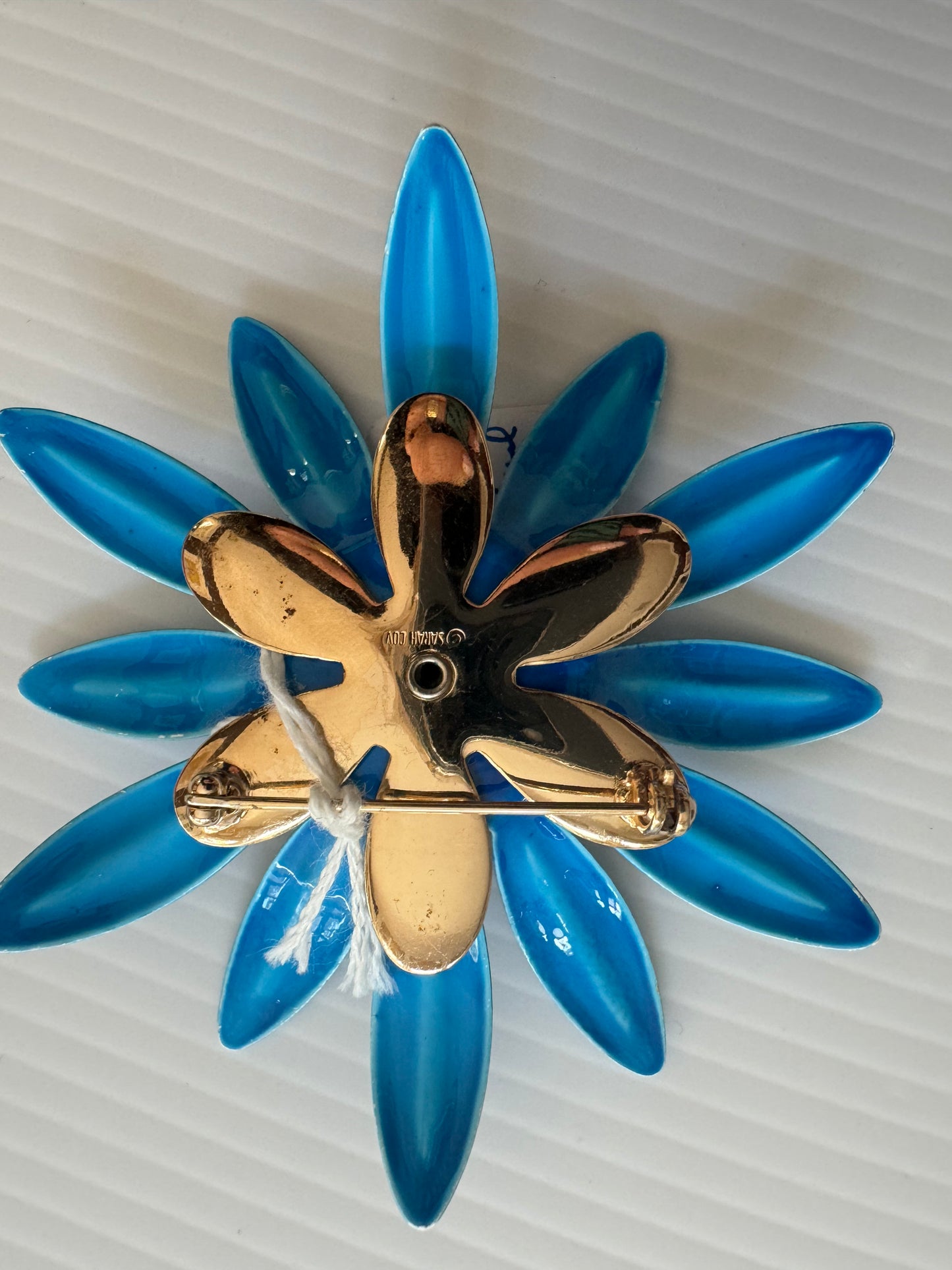 Vintage Sarah Coventry blue enamel brooch with gold tone center