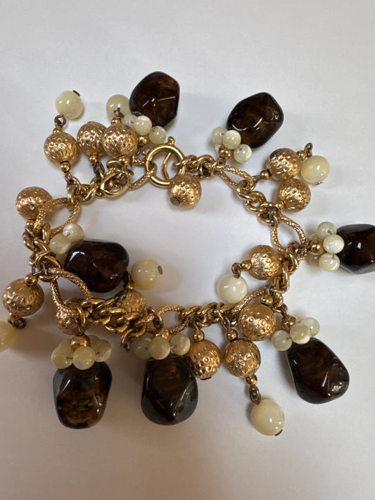 1960s fun signed NAPIER charm bracelet with gold satin balls and root beer Brown lucite dangles