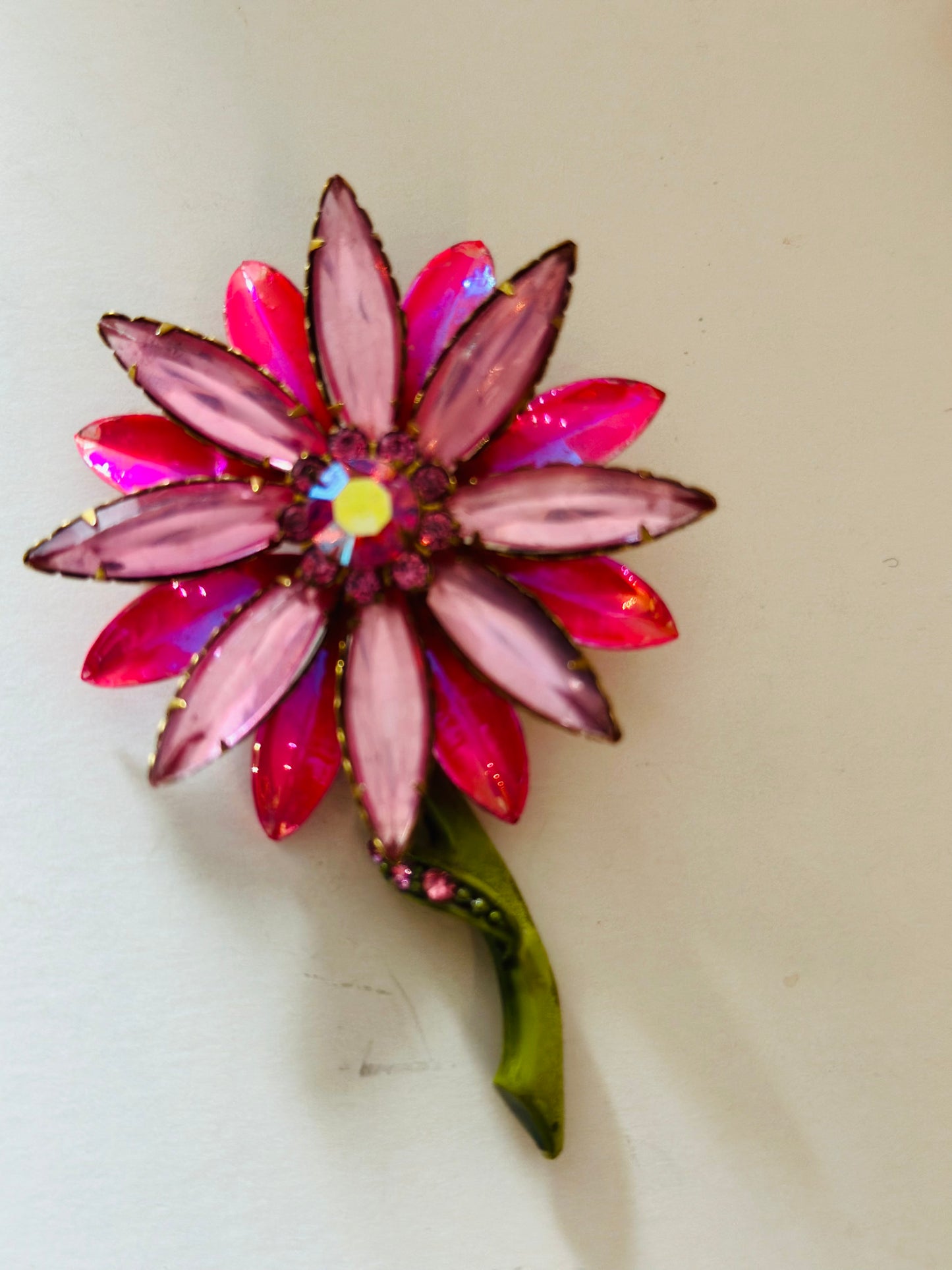 pink flower brooch with rhinestones and stem