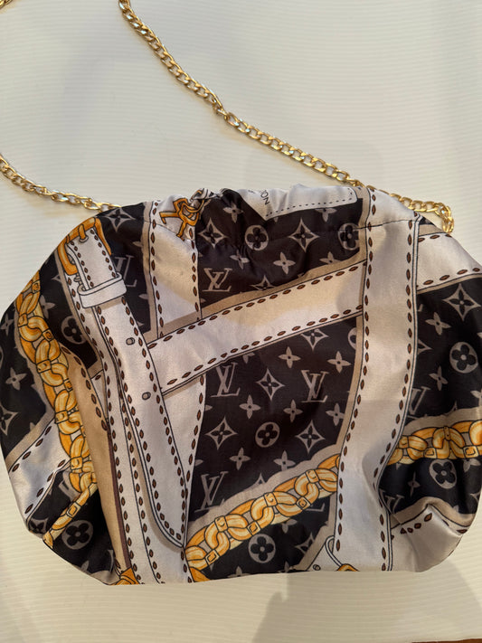 Vintage silk scarf reimagined as a clutch bag. Comes with chain shown