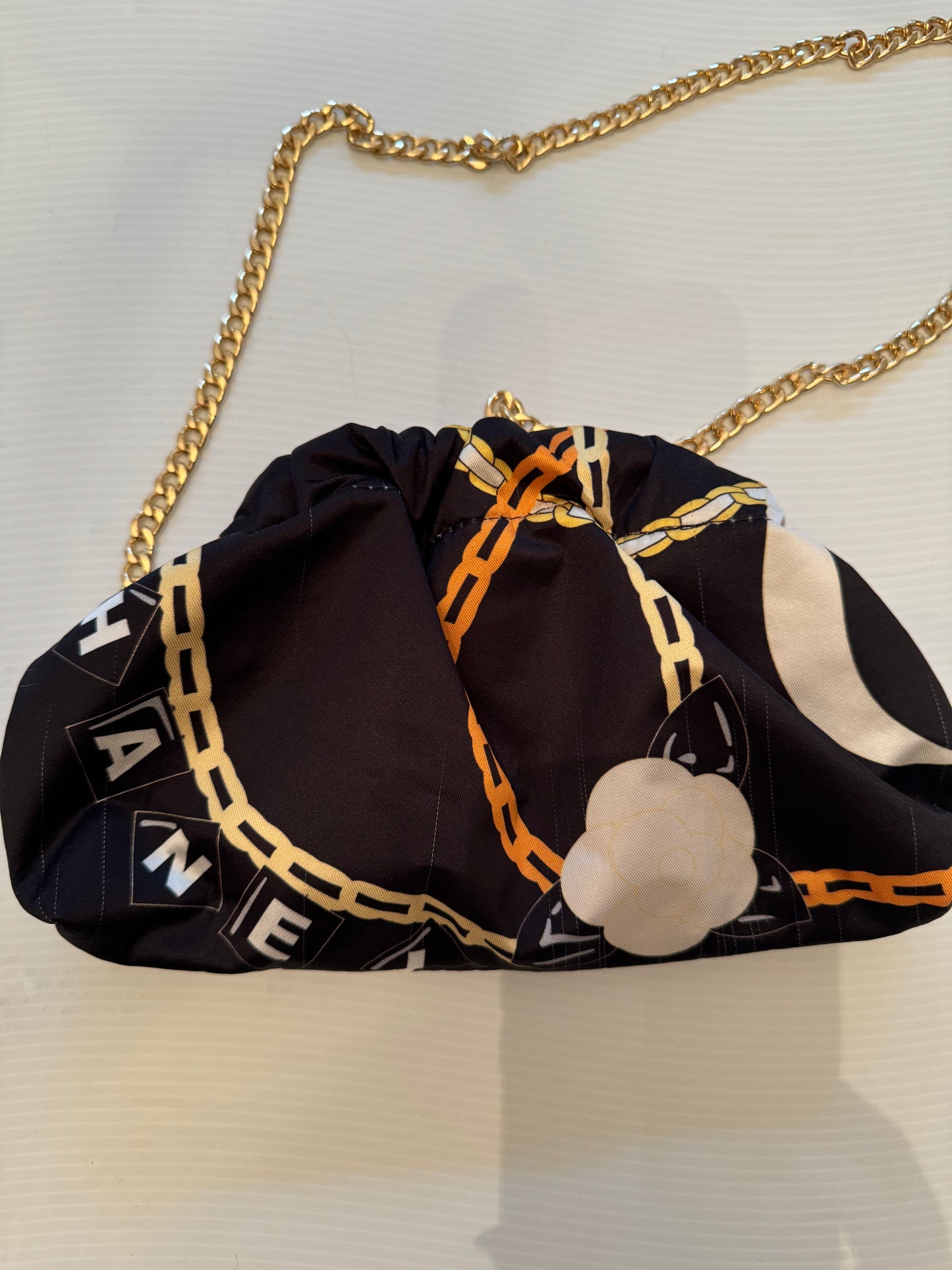 Vintage mini silk scarf reimagined as a clutch bag. Comes with crossbody chain shown