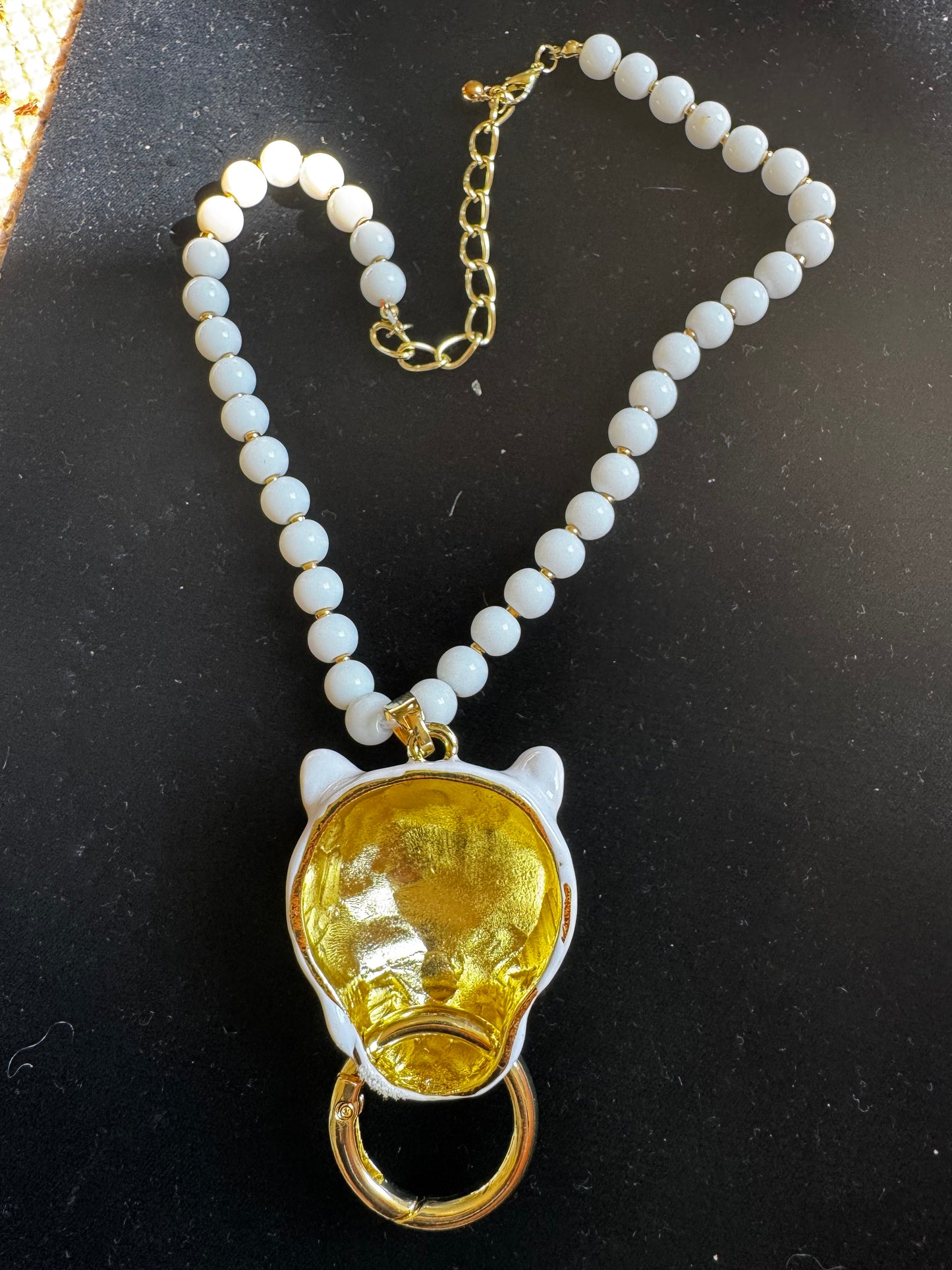 Fun 1990s white plastic lion-head necklace