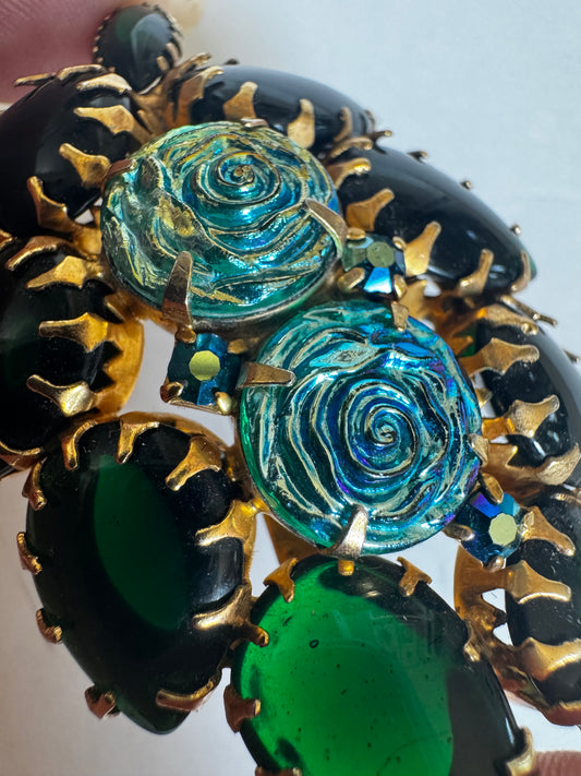 Unsigned beauty brooch attributed to Alice Caviness with carved glass iridescent roses and gorgeous emerald green glass stones