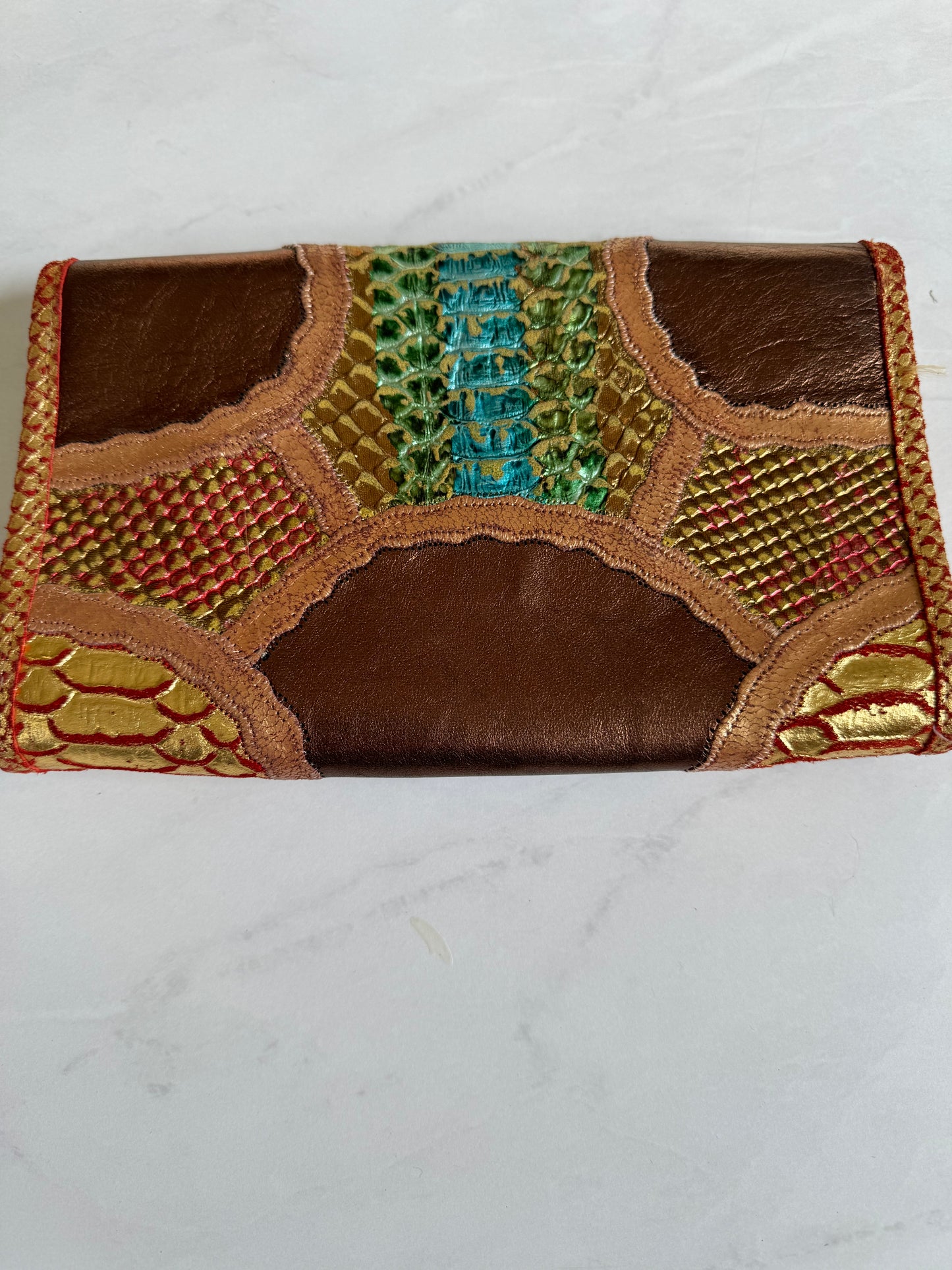 Gorgeous vintage Carlos Falchi clutch with iridescent snake print and bronze colorway