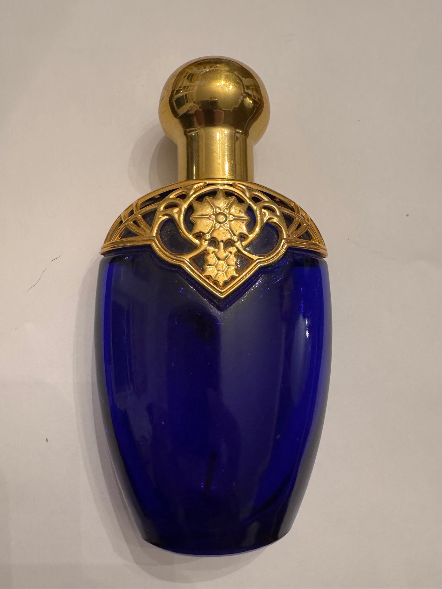 1970s cobalt blue bottle by AVON with gold decorative top