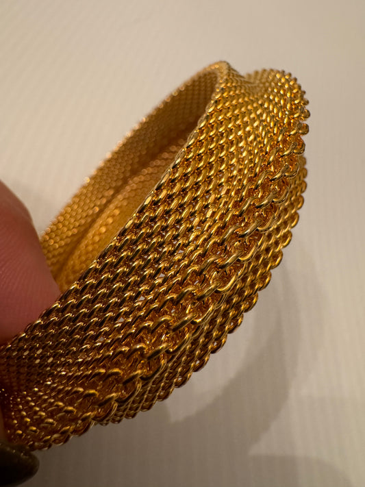 1980s gold tone mesh bangle with braid. shown in front here