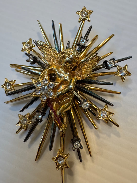 Beautiful gold tone signed 1998 and gun metal rhinestone Cupid brooch/pendant