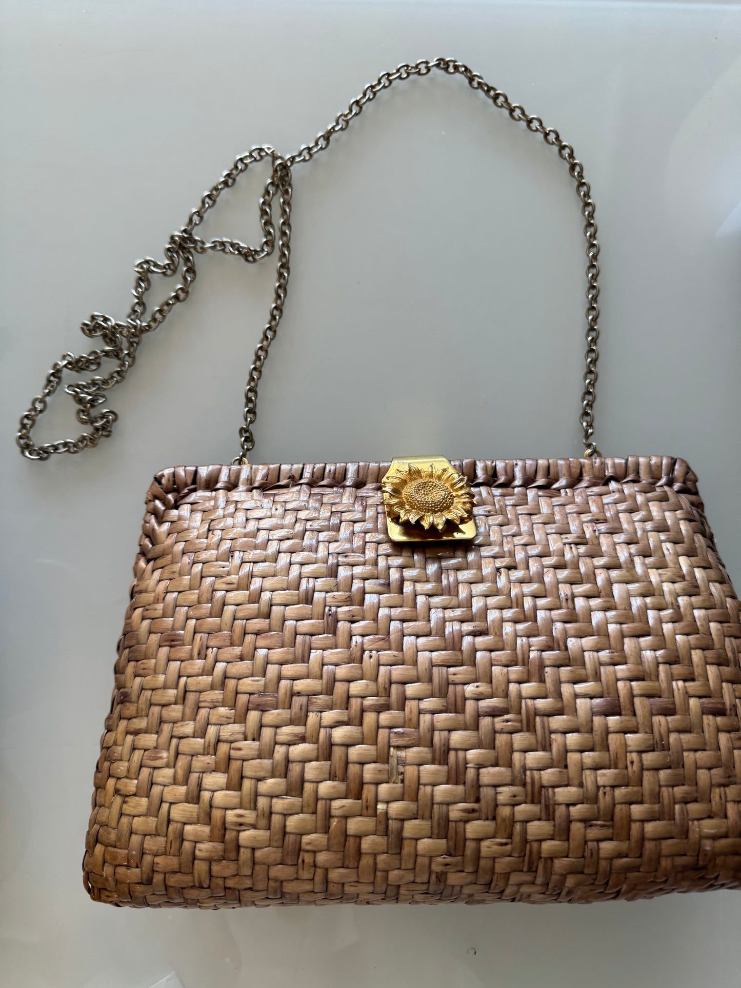 Natural shade raffia clutch with gold tone sunflower clasp