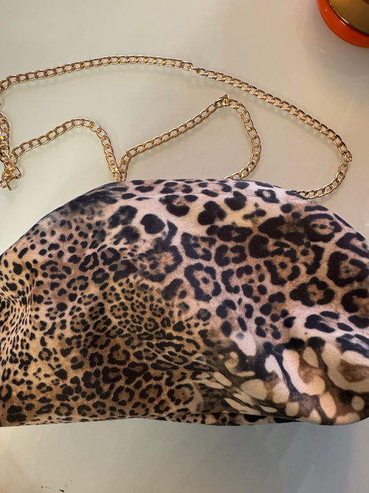 Exclusive Limited Edition MINI Vavra New York convertible clutch bag with optional crossbody strap. Faded leopard print