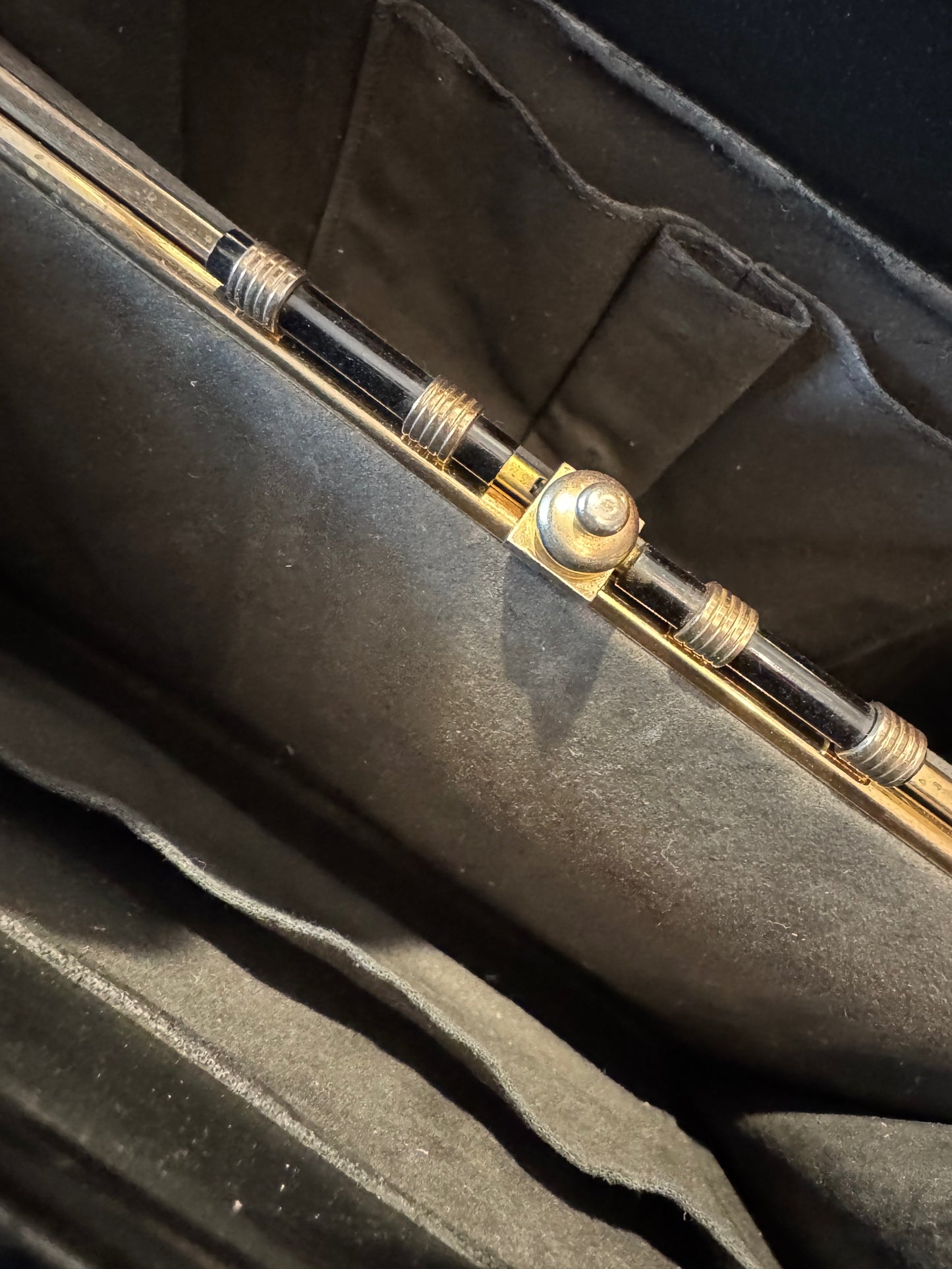 Fantastic 1960s faux leopard fur and black leather handbag. Beautiful interior hardware with three roomie compartments.