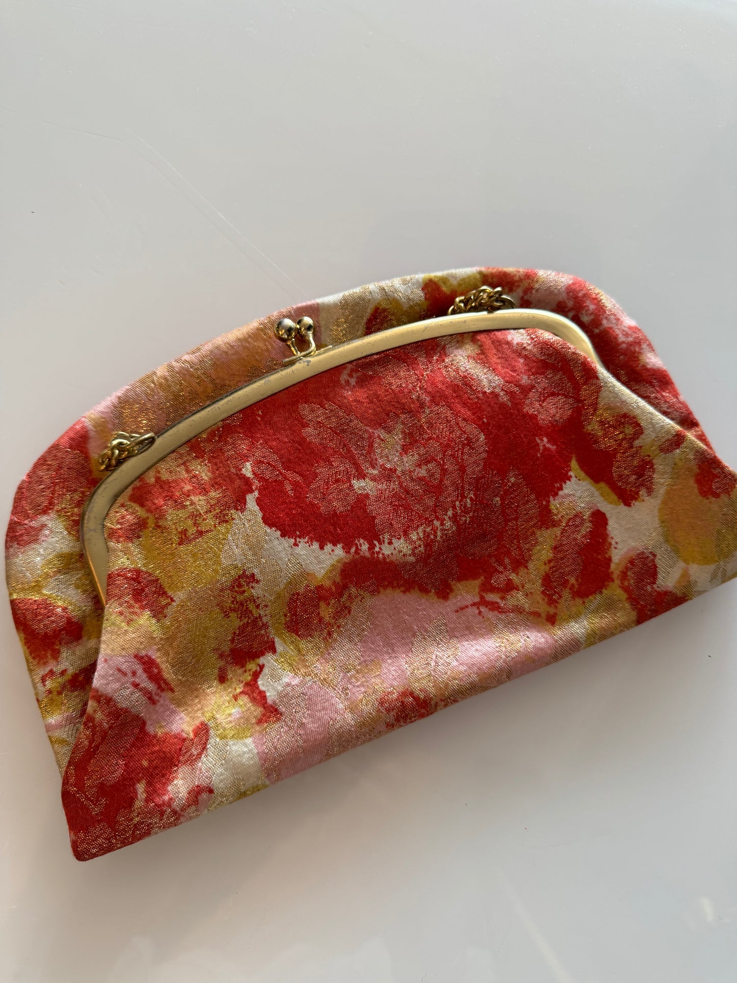 Vintage fabric fold over clutch with chain.
