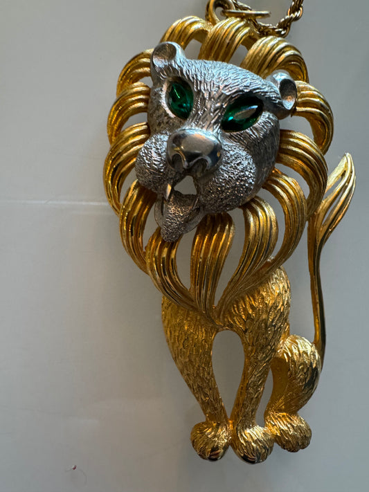 Goldtone Lion pendant with green rhinestone eyes and silver face