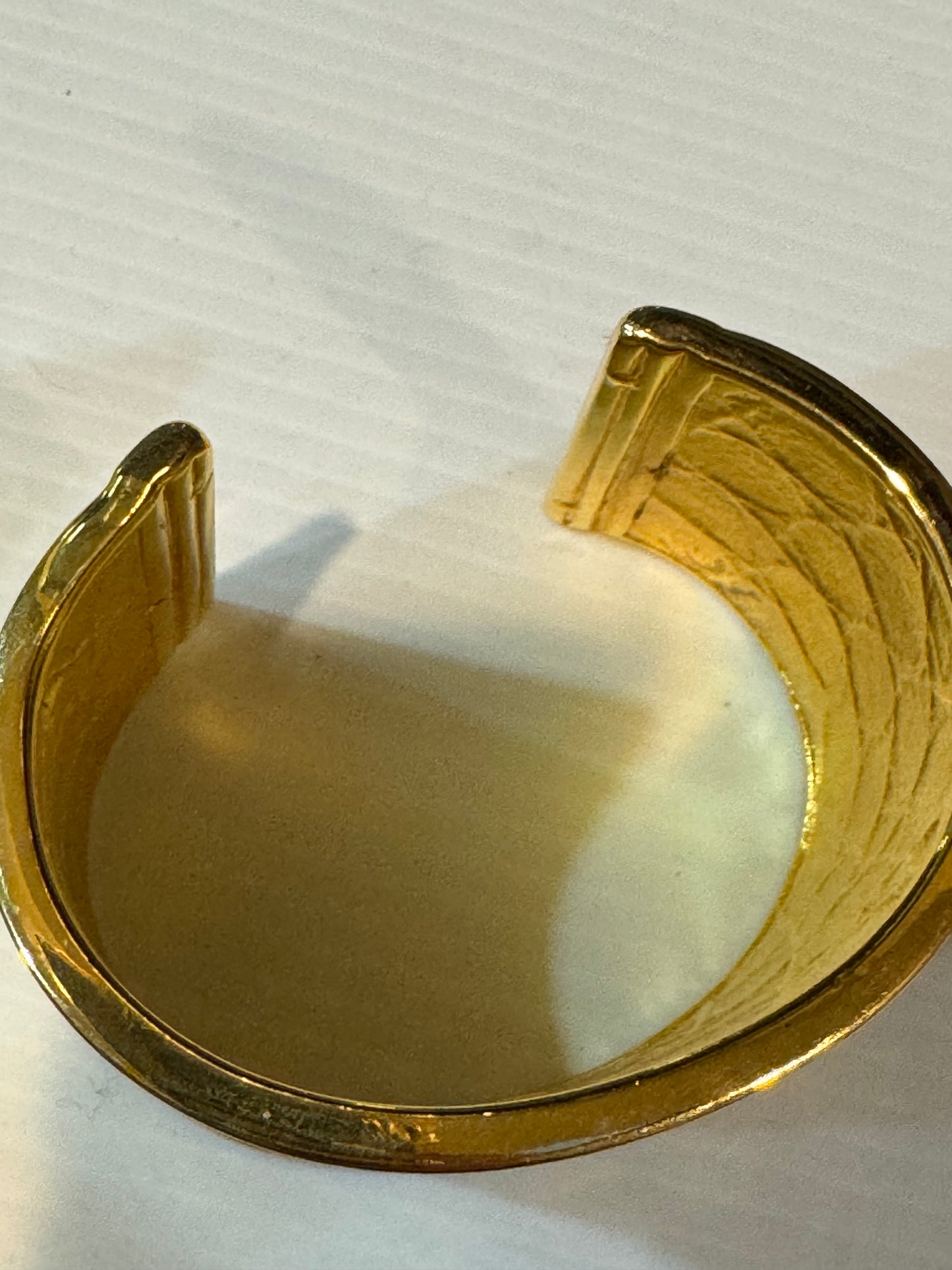 1990s signed St. John reptile embossed gold tone cuff bracelet