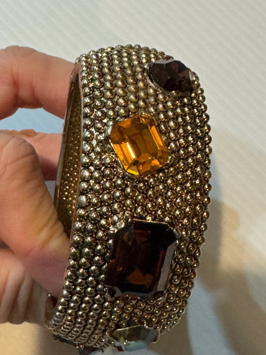 Vintage 1960s CINER clamper/ cuff bracelet with amber and topaz colored rhinestones