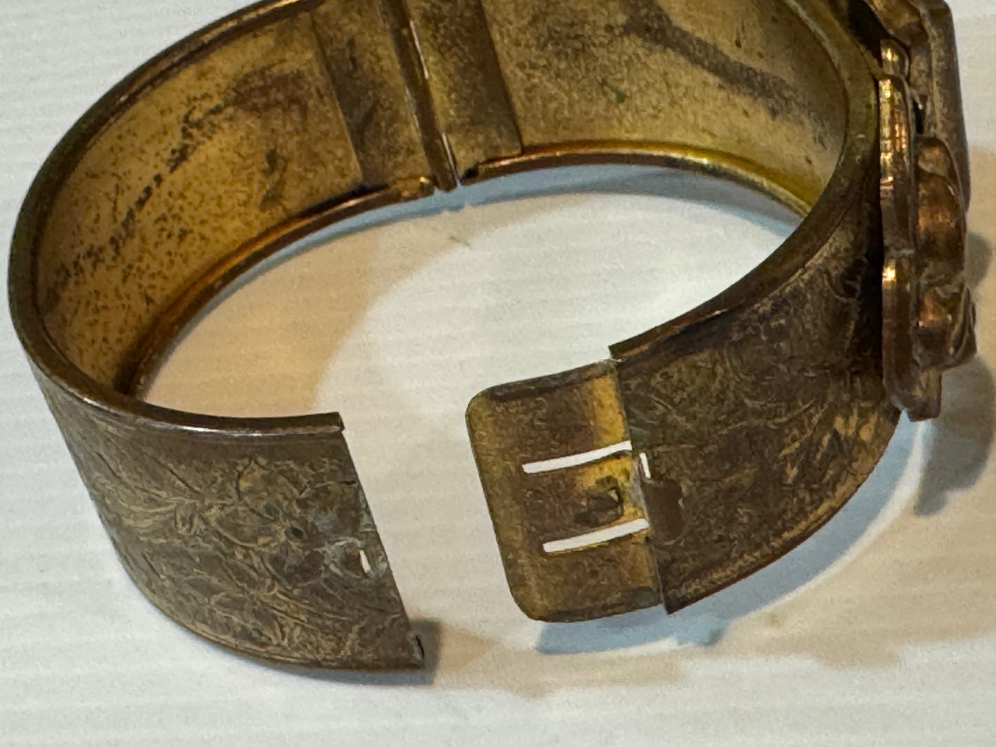 Gold tone vintage 1960s cuff bracelet with flower etching