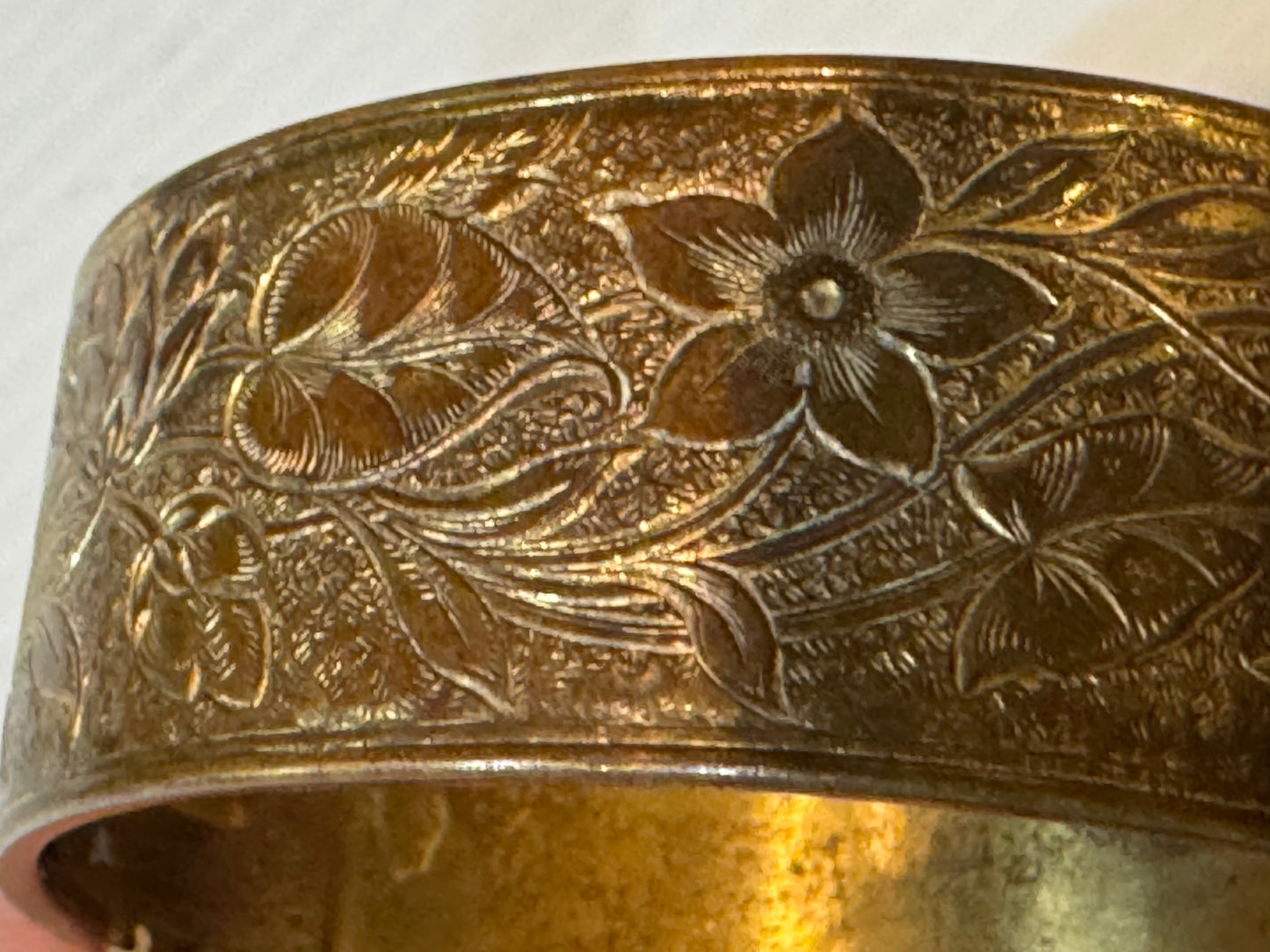 Gold tone vintage 1960s cuff bracelet with flower etching