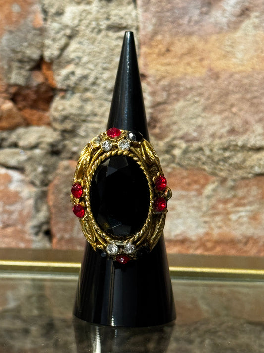 Gorgeous 1960s "poison" gold tone with black cabochon and red rhinestone ring