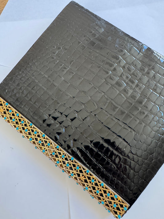 1950s glamorous black crocodile clutch with decorative flower closure in gold tone and turquoise