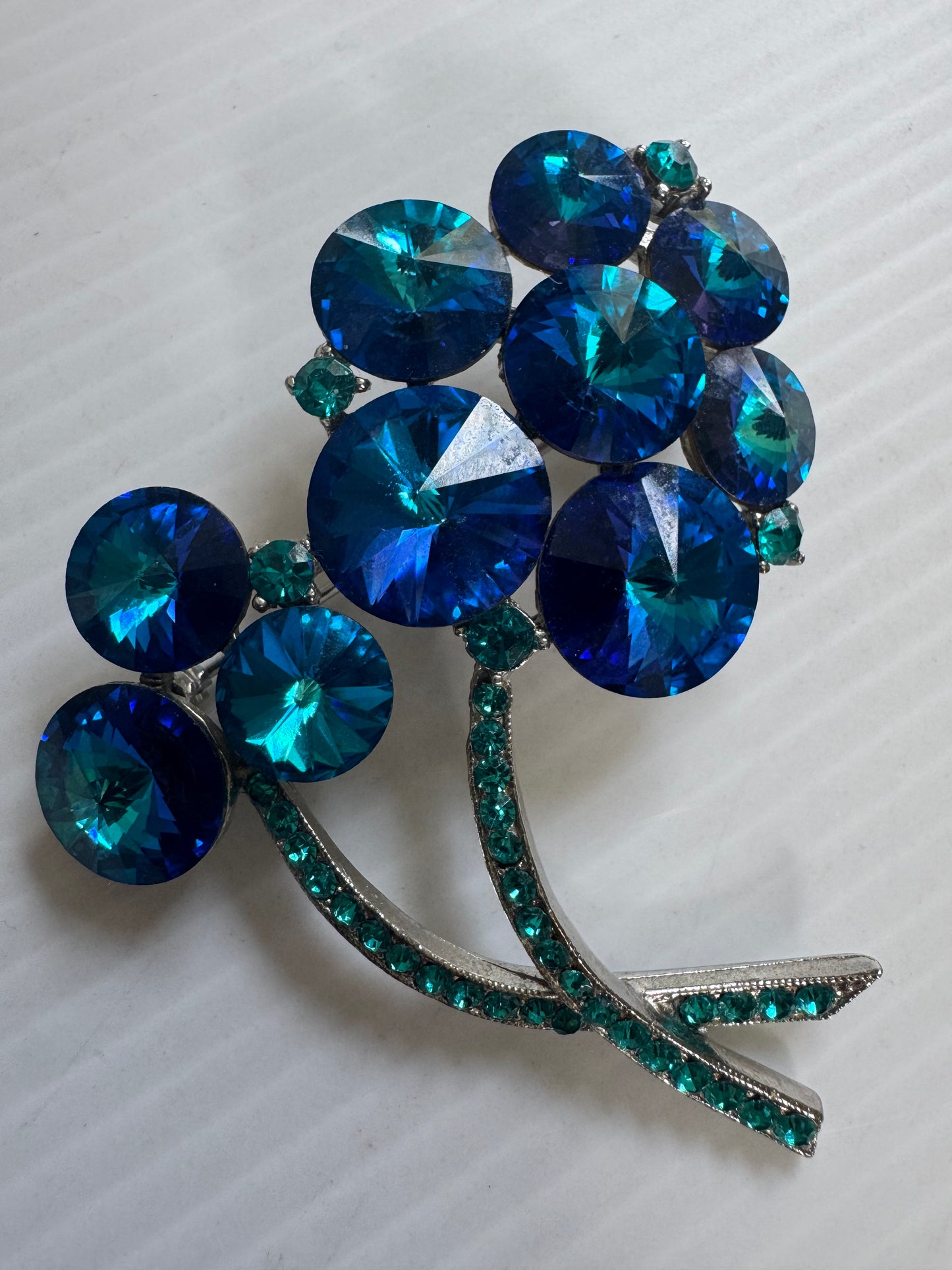 ￼ 1950s signed Weiss Blue watermelon stone flower brooch with sparkling emerald/turquoise colored rhinestones