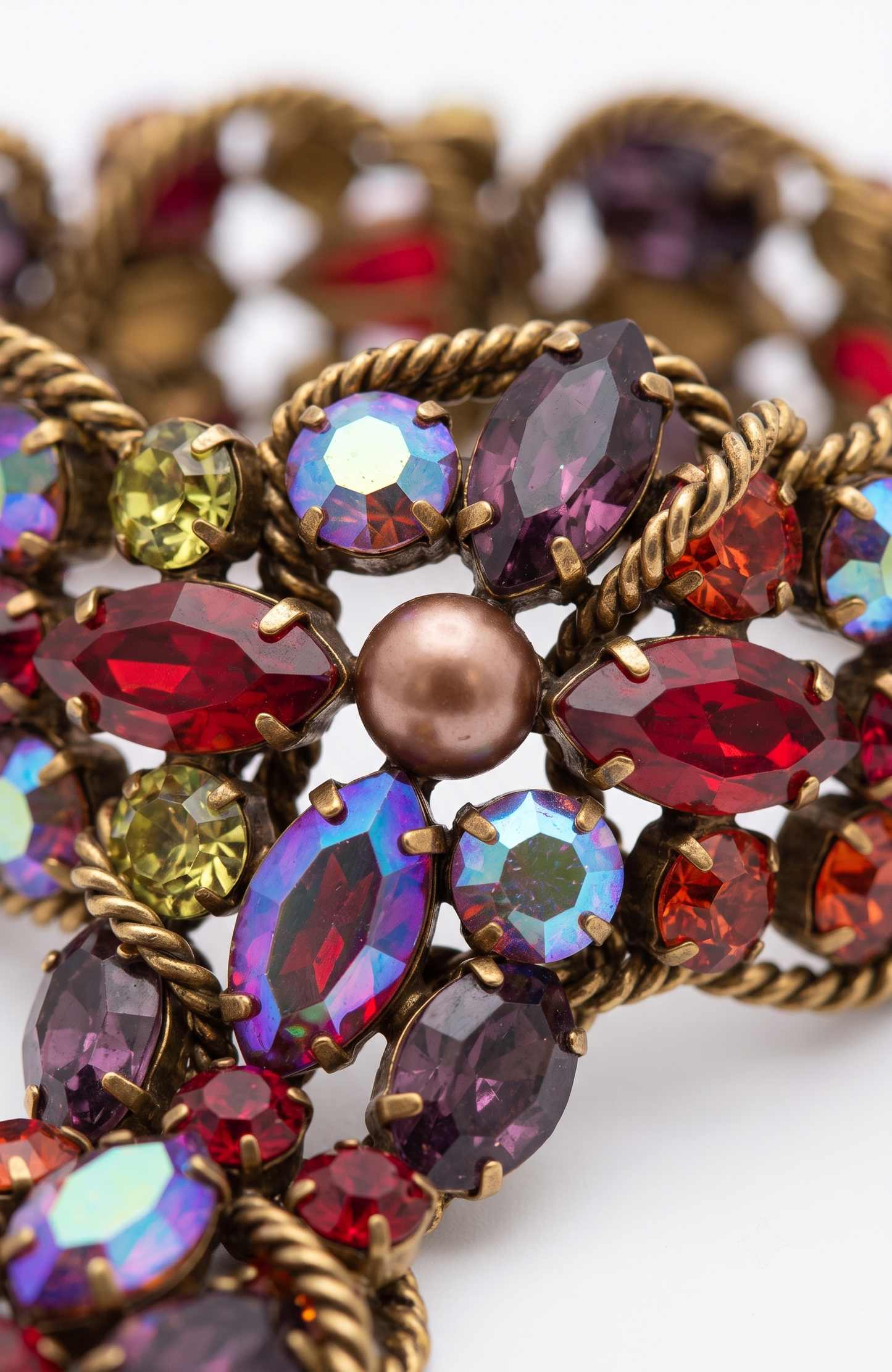 1950s signed KRAMER of NY rhinestone bracelet featuring red crystals and aurora borealis with a gold link chain throughout ￼