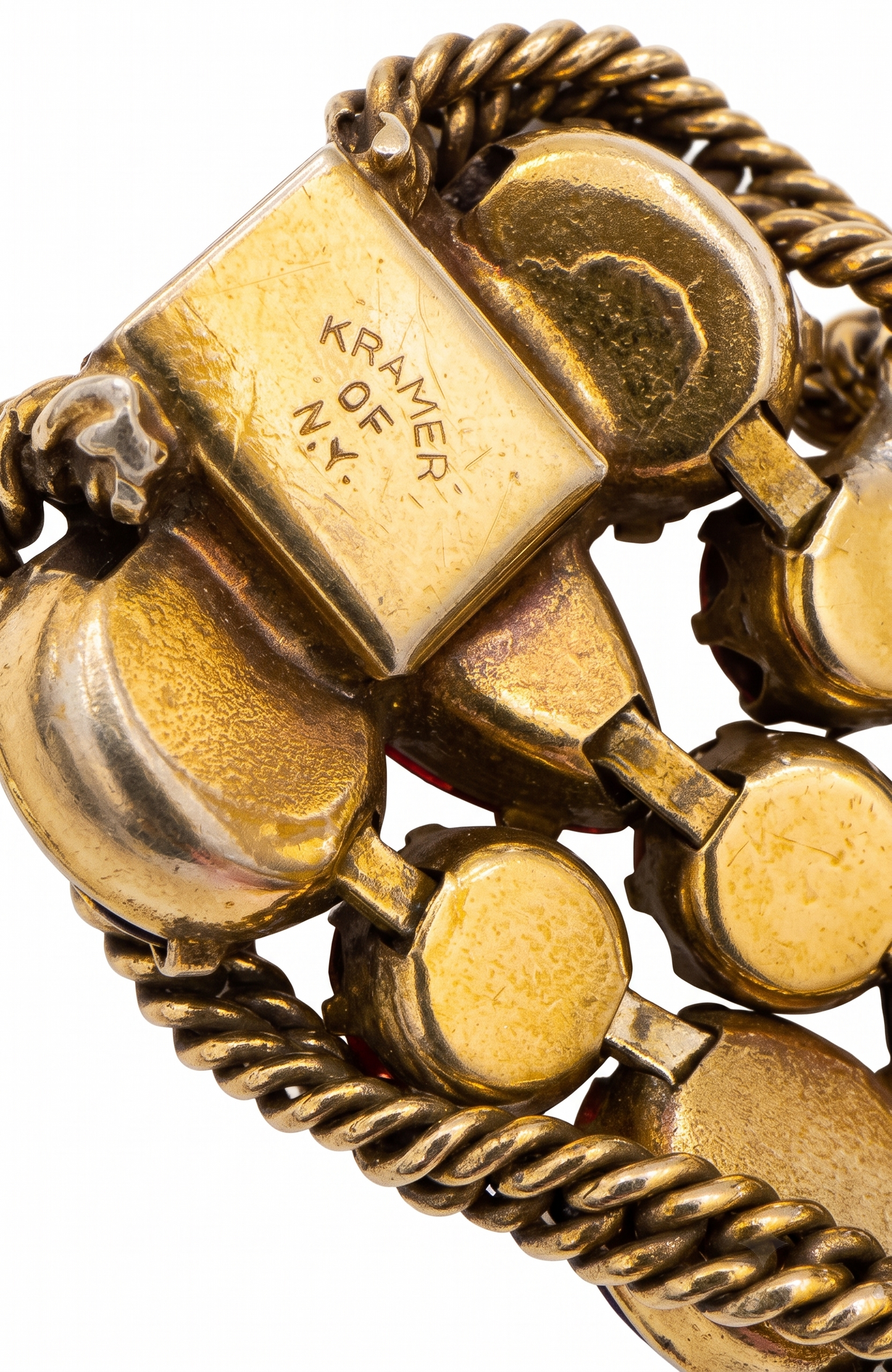 1950s signed KRAMER of NY rhinestone bracelet featuring red crystals and aurora borealis with a gold link chain throughout ￼