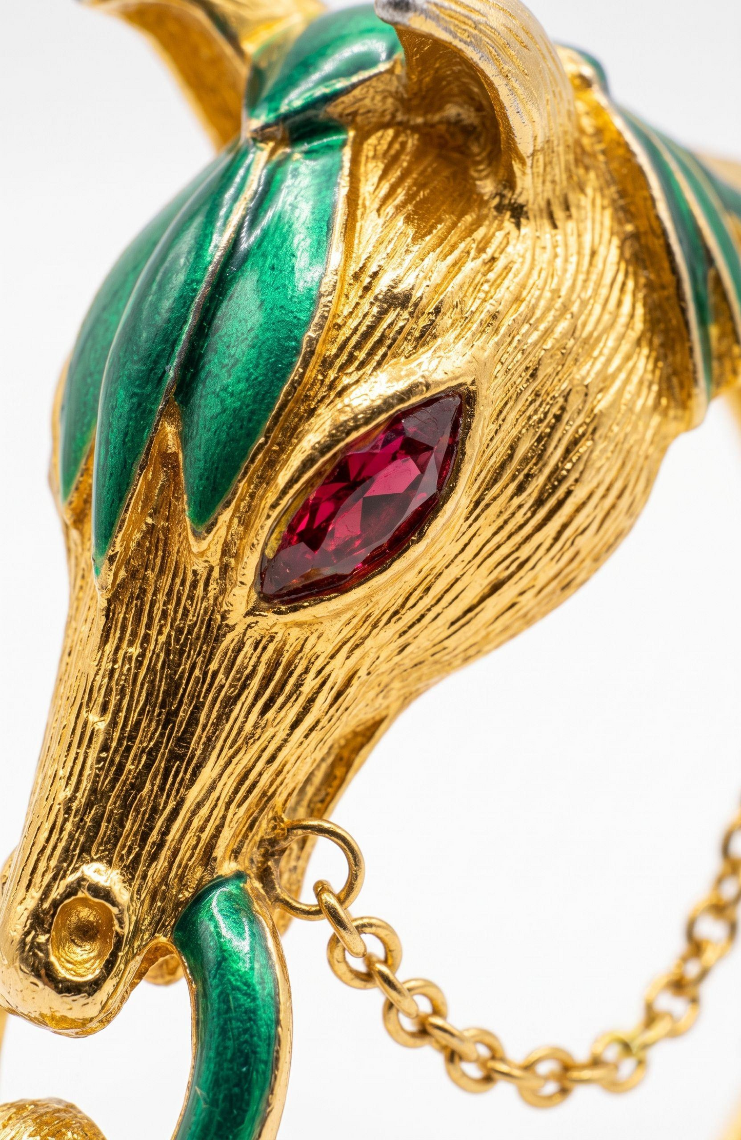 Vintage gold plate and enamel horse clamper bracelet with pink rhinestone eyes
