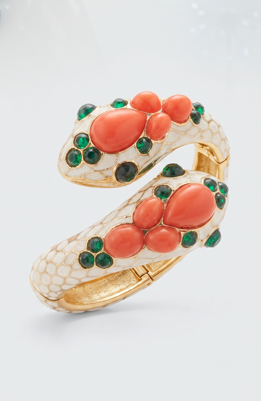 Trifari gorgeous 1968 snake clamper bracelet with green glass and faux coral cabachon stones. Unsigned from L'Orient Collection