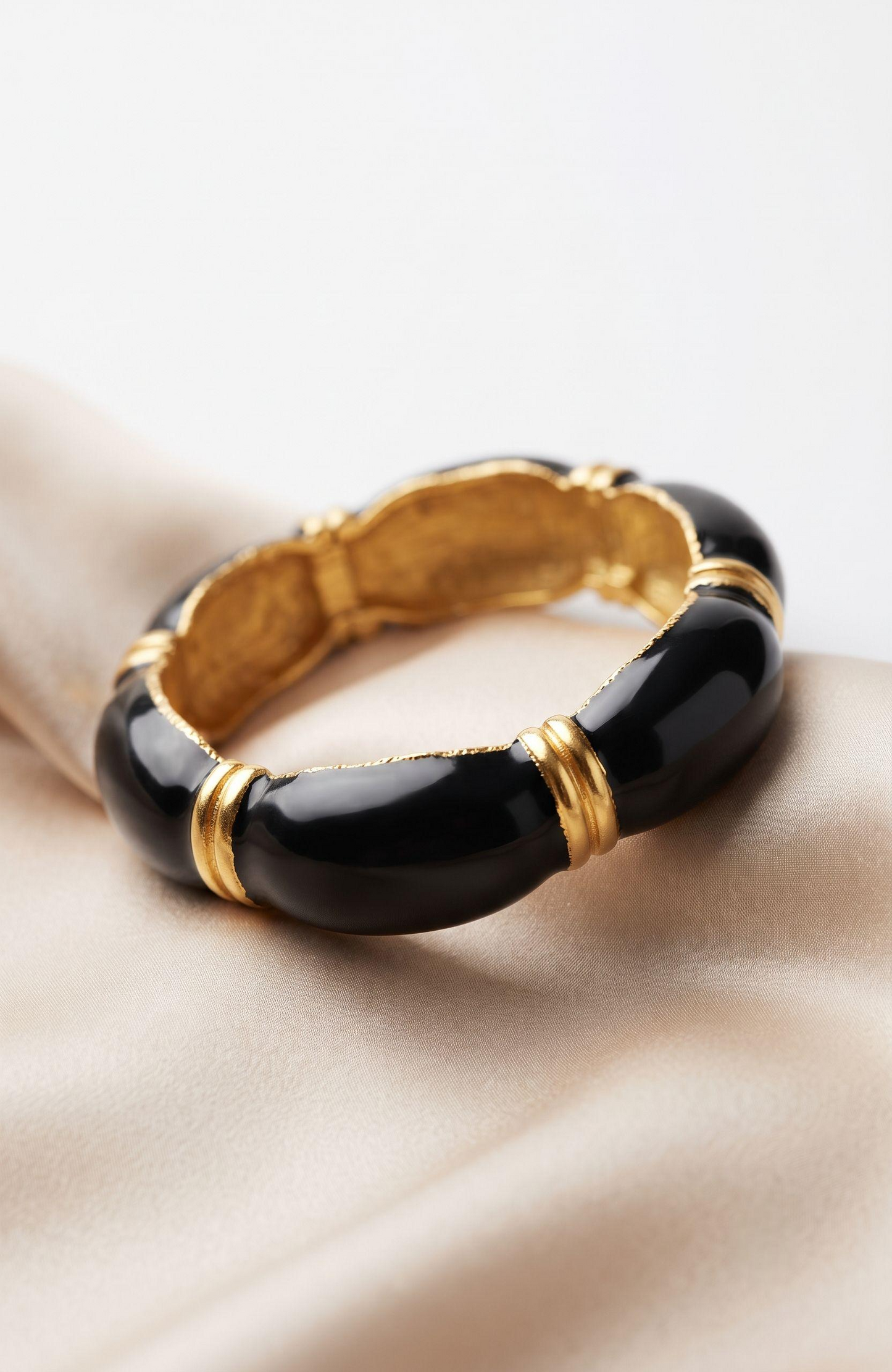 Beautiful 1970s gold tone and black enamel clamper bracelet